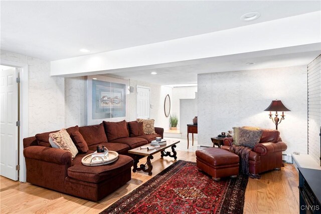 living area featuring wood finished floors and recessed lighting