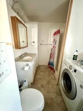 100 Cruger St, Bath, NY 14810 - bathroom with toilet, washer / clothes dryer, vanity, and a shower with shower curtain