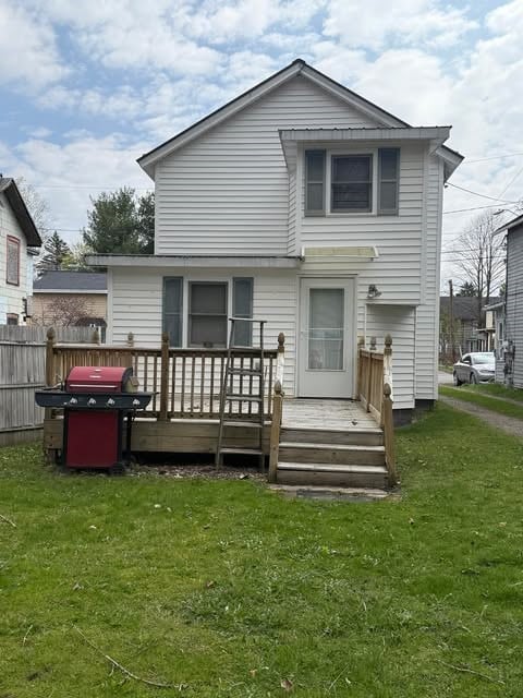 100 Cruger St, Bath, NY 14810 - rear view of property with a wooden deck, fence, and a yard