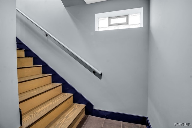 staircase with tile patterned floors