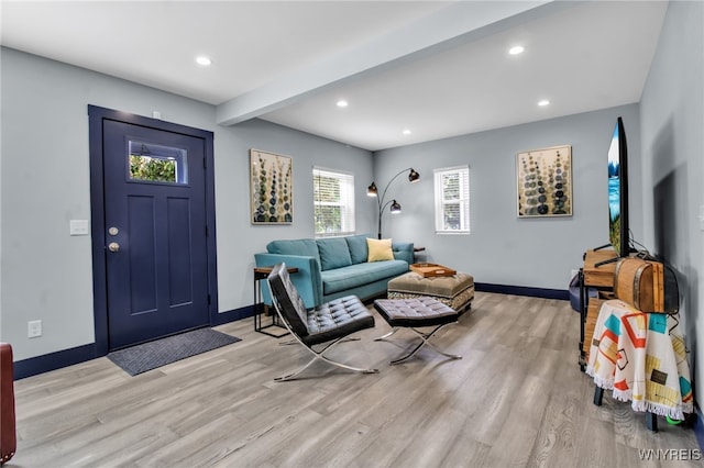 entryway featuring recessed lighting, baseboards, beamed ceiling, and light wood finished floors