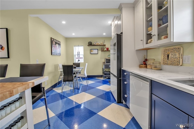 kitchen with dark floors, recessed lighting, white cabinetry, smart refrigerator, and glass insert cabinets