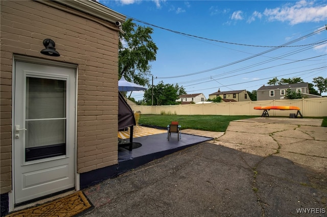 view of yard with a patio and a fenced backyard