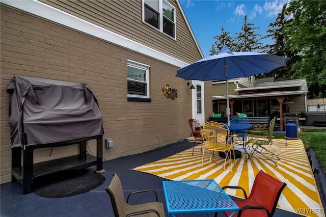 view of patio featuring a grill