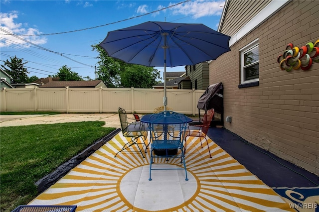 view of patio featuring fence