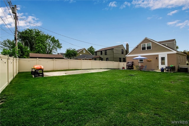 view of yard featuring central AC, a patio, and a fenced backyard