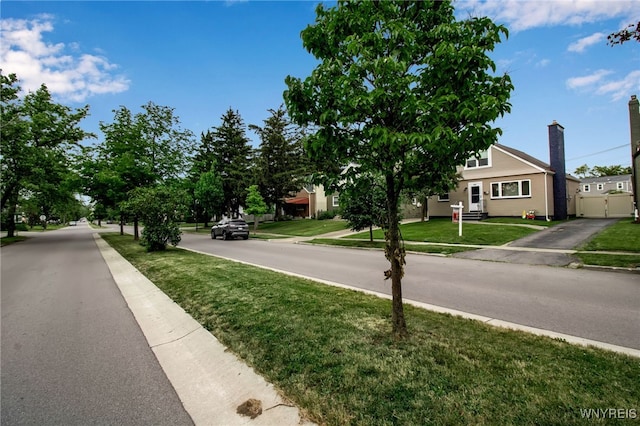 view of street with sidewalks and curbs