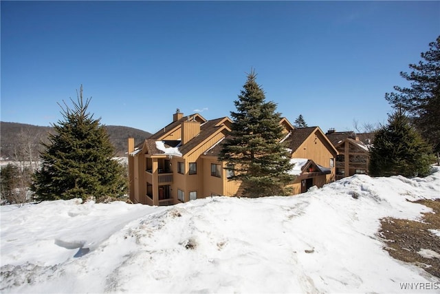 G303 Snowpine, Great Valley, NY 14741 - exterior space featuring a garage and a chimney