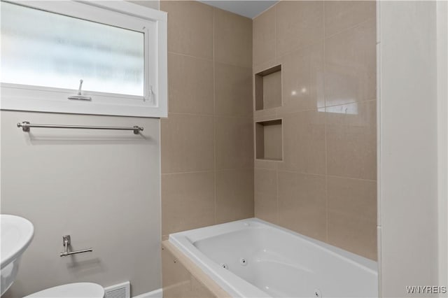 bathroom featuring visible vents and toilet