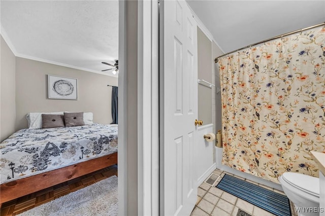 tiled bedroom featuring a ceiling fan and crown molding