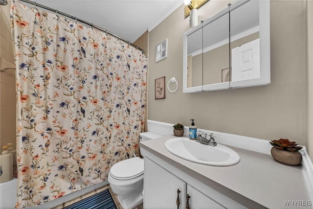 bathroom with vanity, toilet, and shower / bath combo with shower curtain