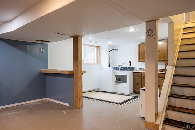 below grade area with washing machine and dryer, recessed lighting, baseboards, and stairs