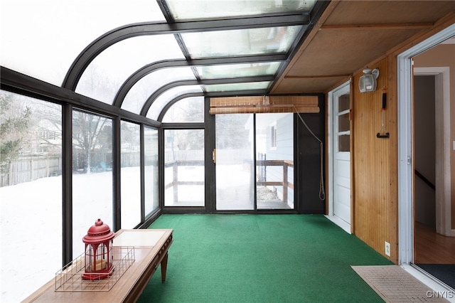 unfurnished sunroom with plenty of natural light