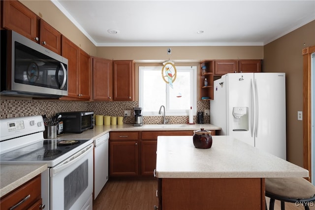 kitchen with white appliances, light countertops, and decorative backsplash