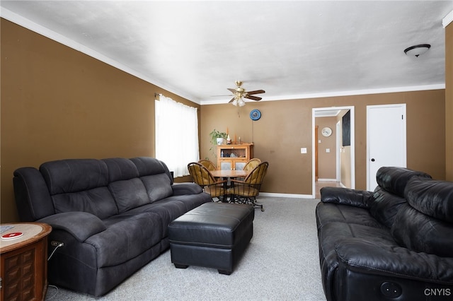 living room featuring a ceiling fan, carpet, and baseboards