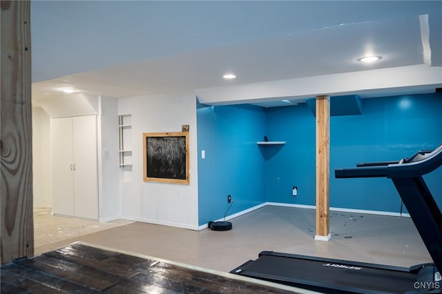 exercise room with baseboards and recessed lighting