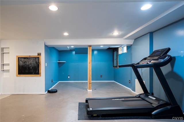 exercise room with recessed lighting and baseboards