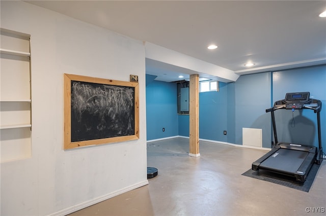 workout area featuring baseboards and recessed lighting