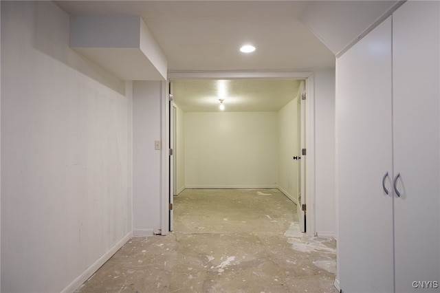 hall featuring baseboards