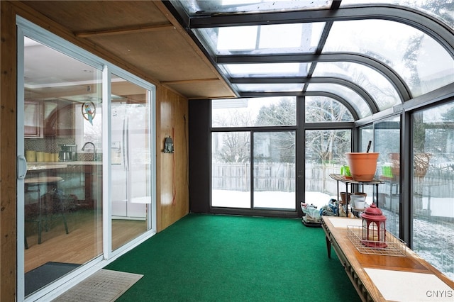 unfurnished sunroom with plenty of natural light