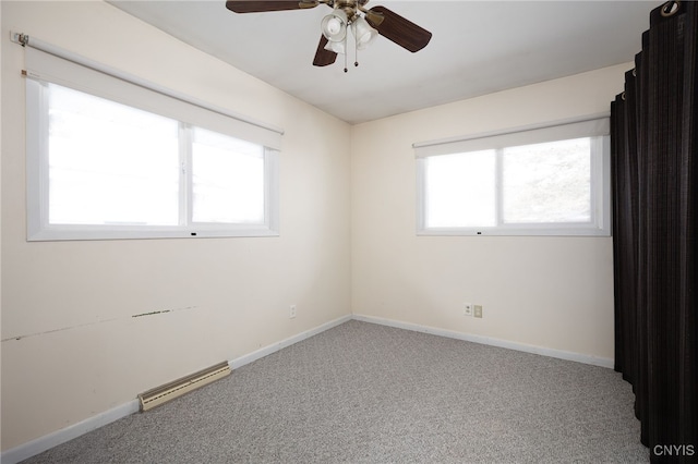 carpeted empty room featuring visible vents, ceiling fan, and baseboards