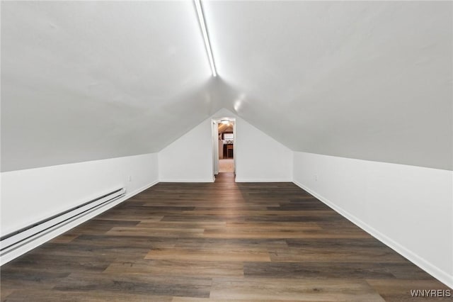 bonus room featuring vaulted ceiling, baseboard heating, wood finished floors, and baseboards