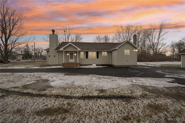 view of front of property featuring a chimney