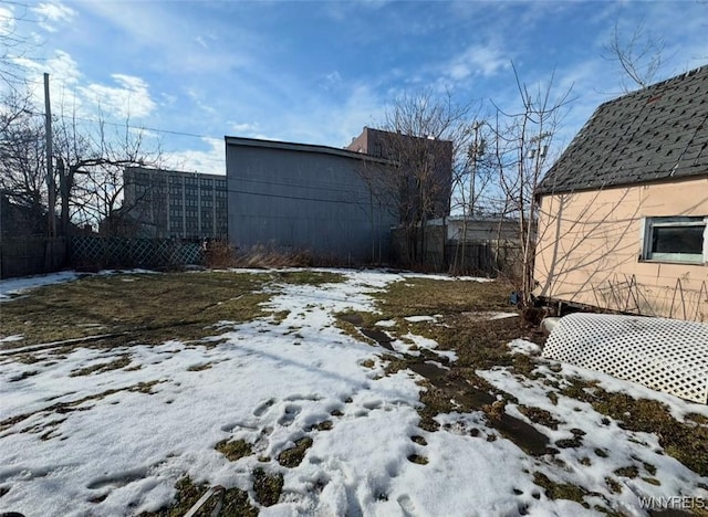 view of yard layered in snow