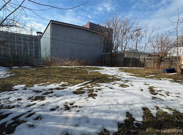 view of yard layered in snow