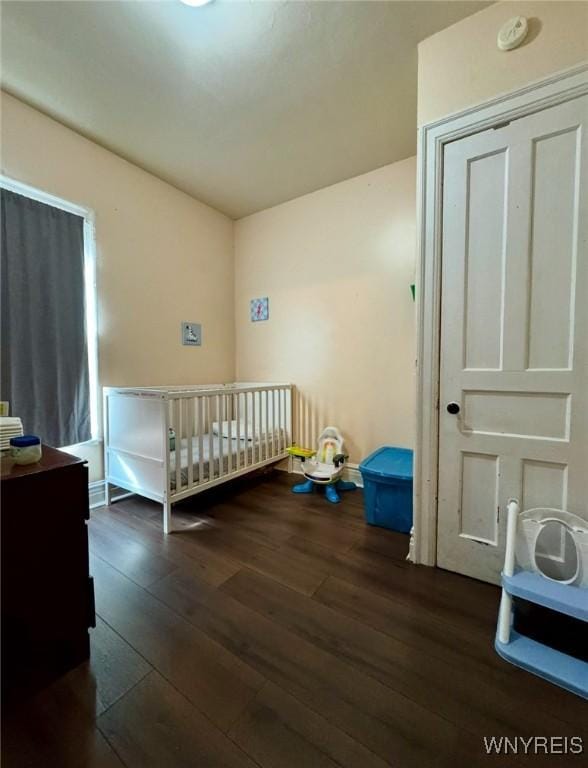 bedroom with hardwood / wood-style flooring