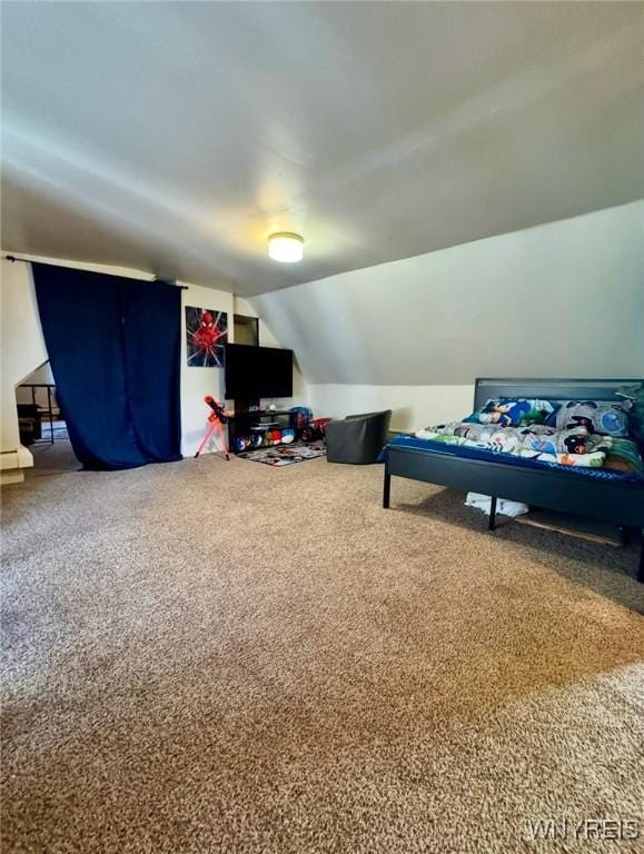 recreation room featuring carpet and lofted ceiling