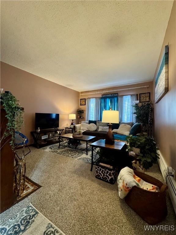 carpeted living room featuring a baseboard heating unit and a textured ceiling