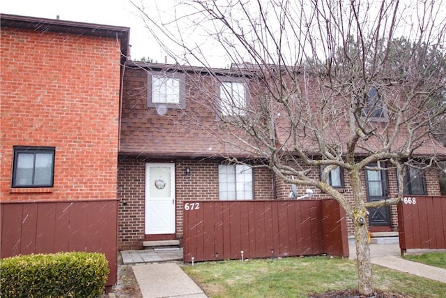 multi unit property featuring brick siding