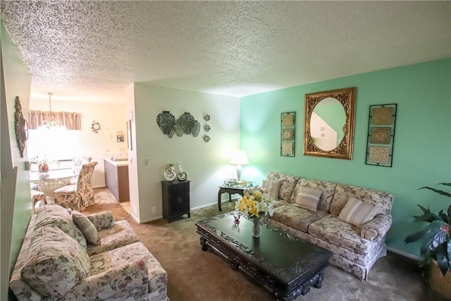 living room with a textured ceiling, baseboards, carpet flooring, and an inviting chandelier