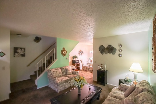 carpeted living room with stairs, a textured ceiling, and baseboards