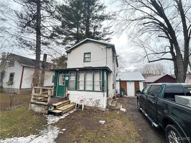 view of front of home with an outdoor structure