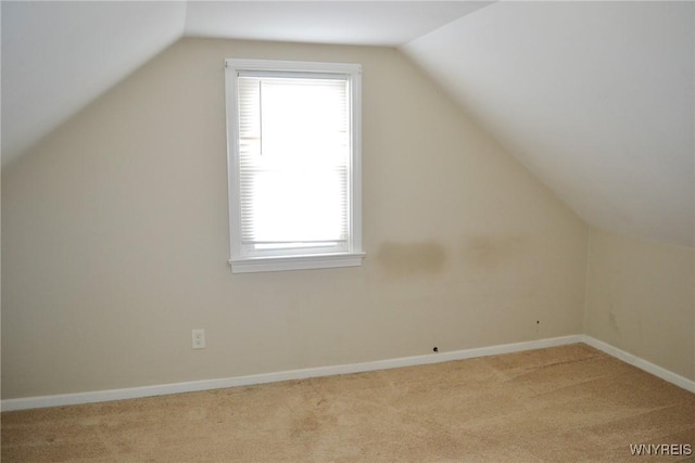 bonus room with carpet flooring, vaulted ceiling, and baseboards