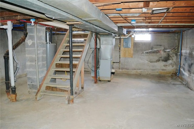 below grade area featuring heating unit, stairs, water heater, and electric panel