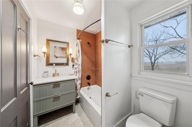 bathroom featuring vanity, toilet, and shower / bathtub combination with curtain