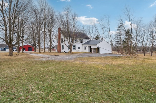 view of front of property with driveway, a garage, and a front yard