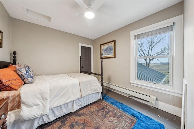 bedroom with baseboard heating and a ceiling fan