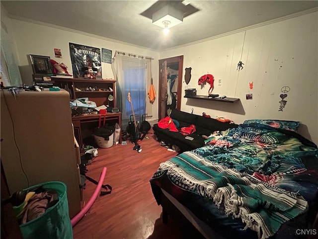 bedroom featuring wood finished floors