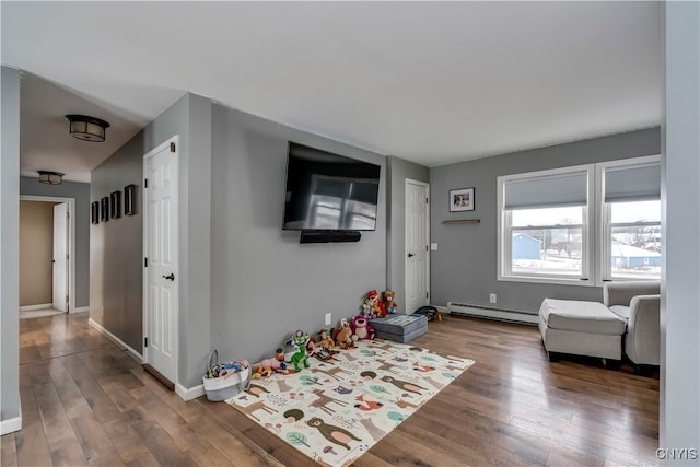 entrance foyer with baseboards, baseboard heating, and hardwood / wood-style flooring