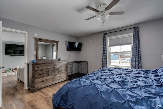 bedroom with a ceiling fan and wood finished floors