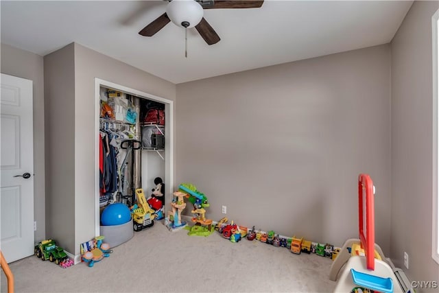 game room featuring carpet flooring and a ceiling fan