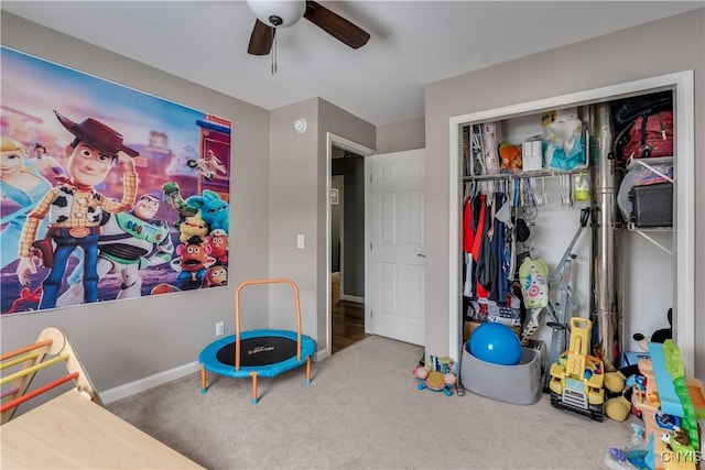 game room featuring ceiling fan, carpet flooring, and baseboards