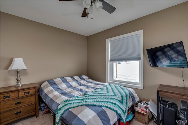 bedroom featuring a ceiling fan and light colored carpet