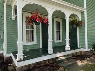 view of property exterior featuring a porch