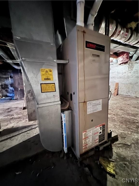 utility room featuring heating unit