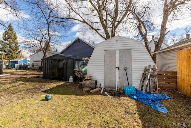 view of shed featuring fence